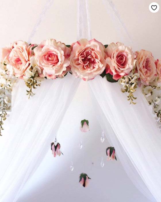 Artificial flowers on a bed canopy