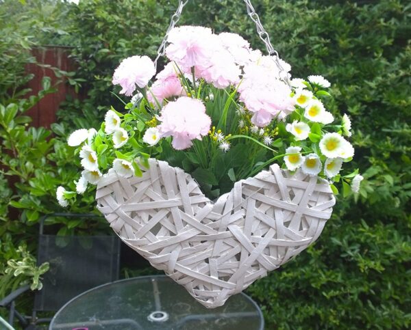Artificial hanging basket with white wicker heart and pink and white flowers