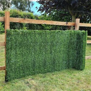 True Products double-sided conifer screening roll supported by a wooden garden fence