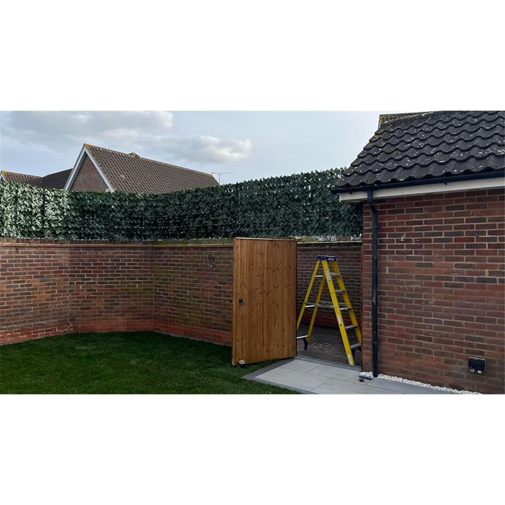 Customer photograph of Outsunny ivy screening fitted above a brick garden wall