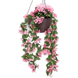 Pink and white trailing artificial flowers in a brown solar-lit hanging basket