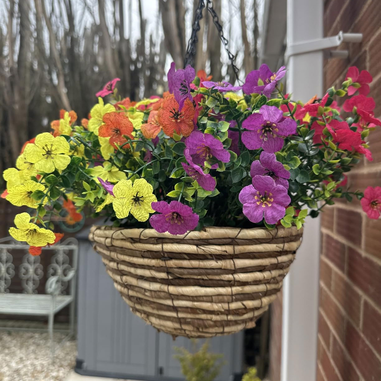 Vibrant artificial hanging basket on wall