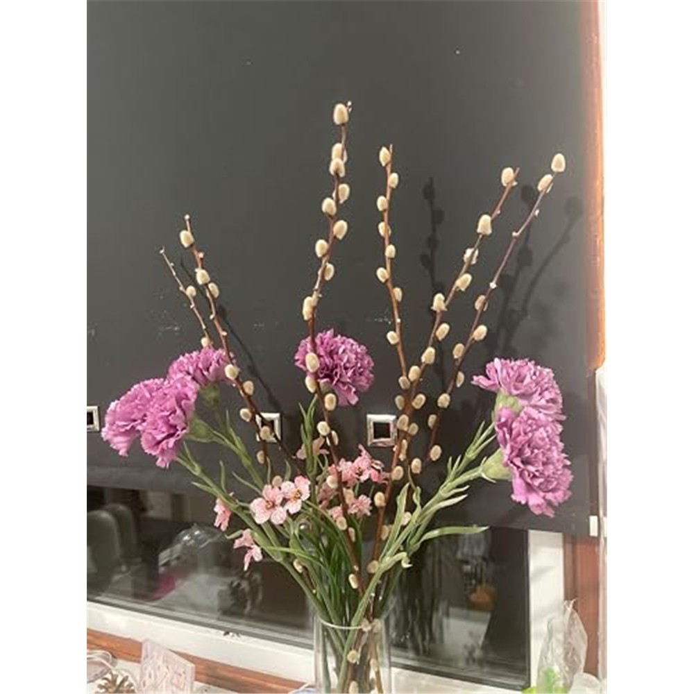 Purple carnations arranged by a customer with blossom and pussy willow branches