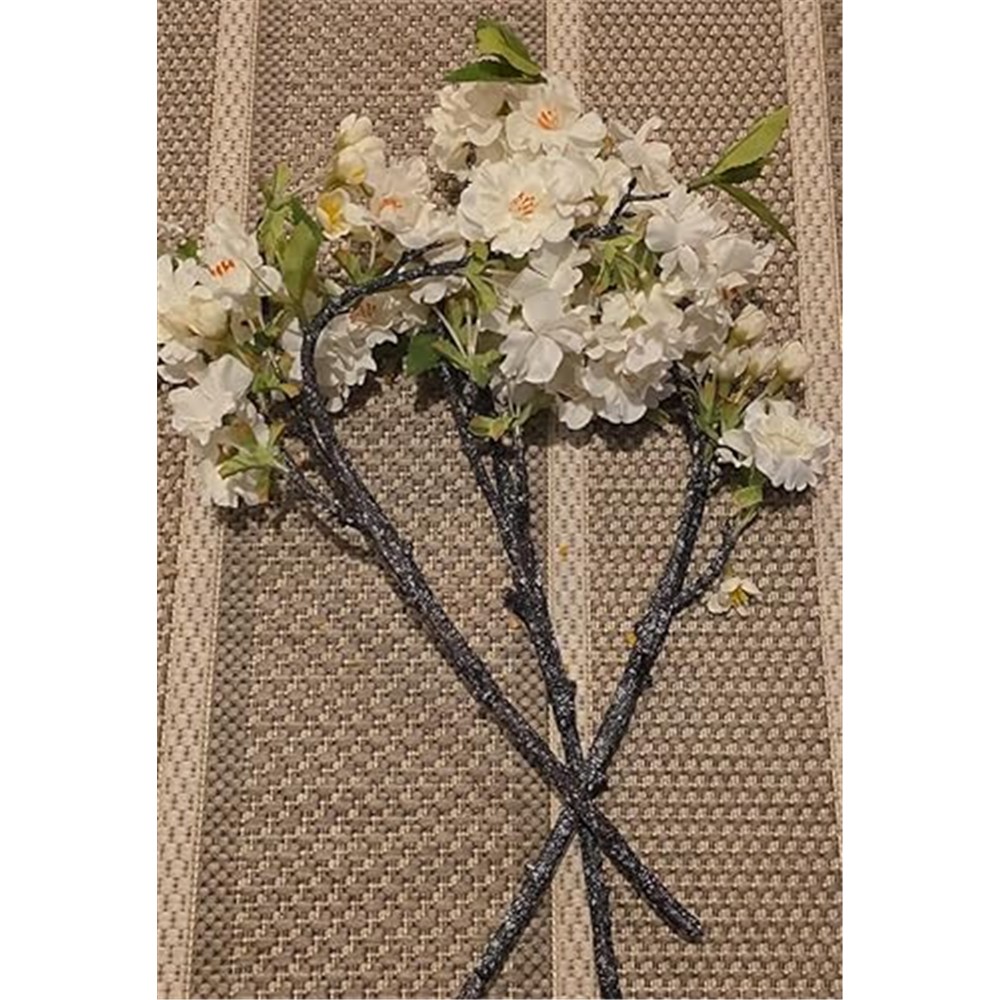 Three loose white cherry blossom branches photographed by a customer