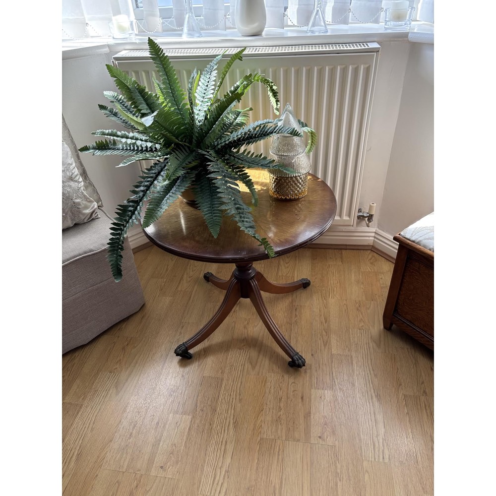 Customer display of hollyone artificial Boston fern in a black pot (60cm spread)