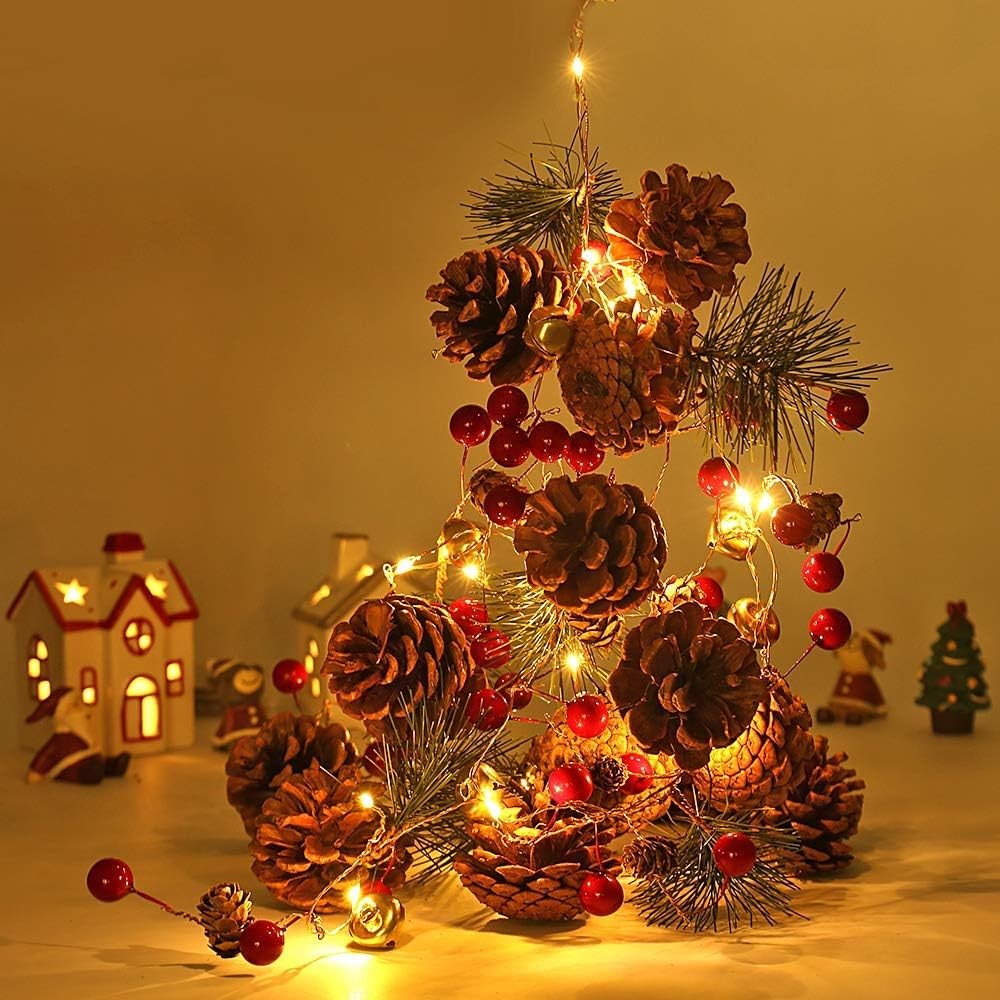 Kevizewo Christmas garland with pine cones, gold bells and lights (200cm)