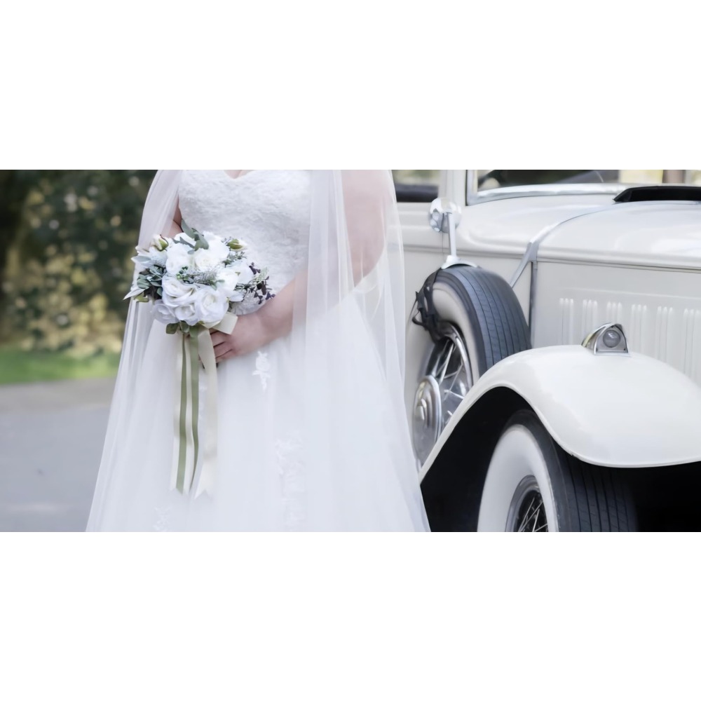 Customer photo: White artificial rose bridal bouquet with soft green foliage