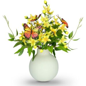 Yellow artificial freesia bouquet with butterflies in an ivory vase